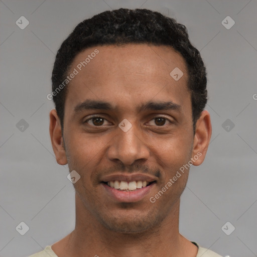 Joyful black young-adult male with short  black hair and brown eyes