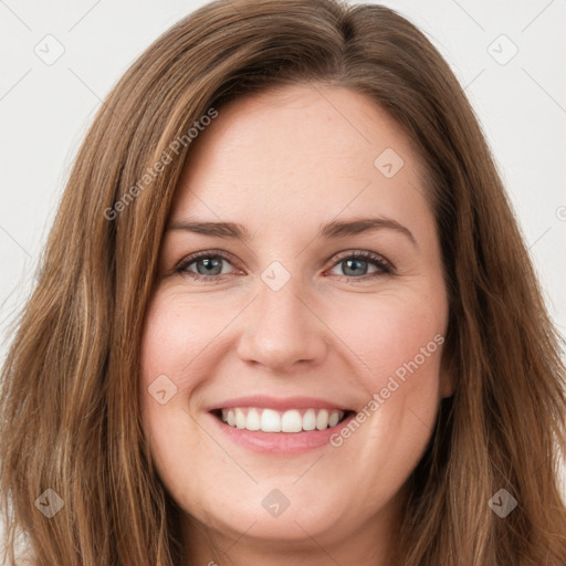 Joyful white young-adult female with long  brown hair and green eyes