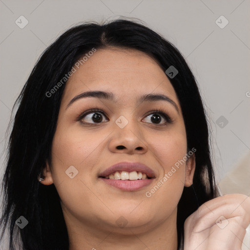 Joyful latino young-adult female with long  black hair and brown eyes