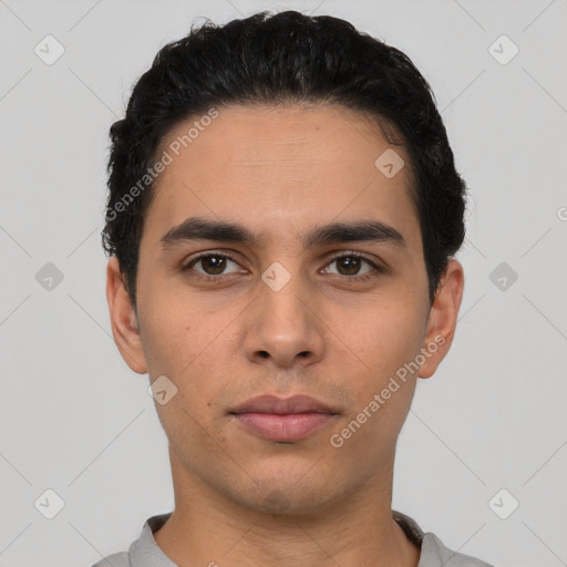 Neutral latino young-adult male with short  black hair and brown eyes