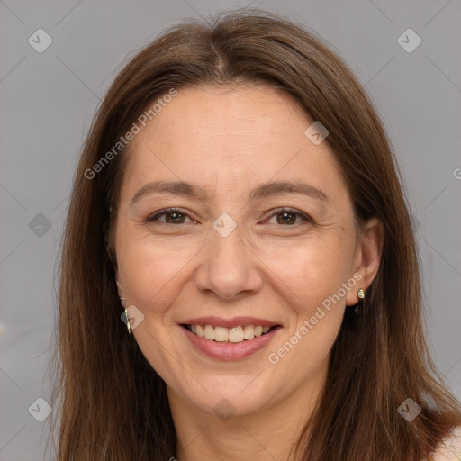 Joyful white adult female with long  brown hair and brown eyes