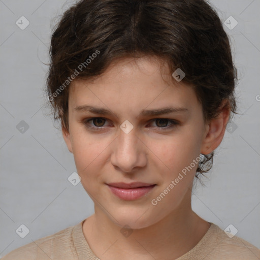 Joyful white child female with short  brown hair and brown eyes