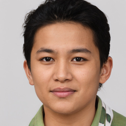 Joyful asian young-adult male with short  brown hair and brown eyes