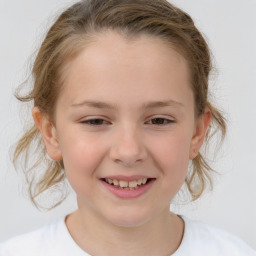 Joyful white child female with medium  brown hair and brown eyes