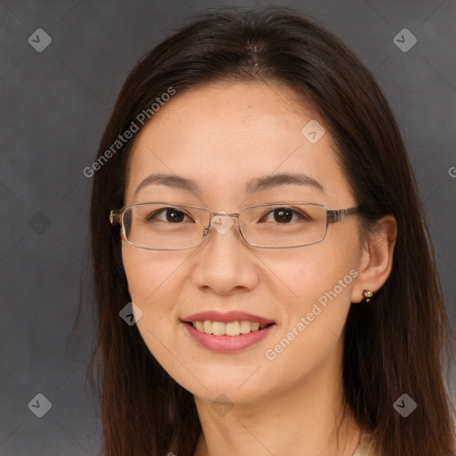 Joyful white adult female with long  brown hair and brown eyes