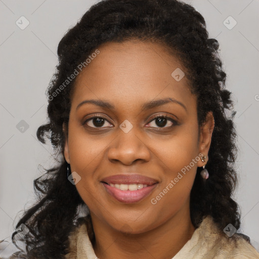 Joyful black young-adult female with long  brown hair and brown eyes