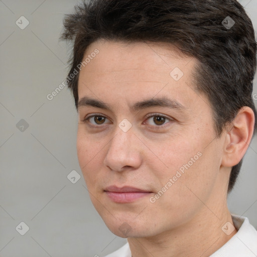 Joyful white adult male with short  brown hair and brown eyes