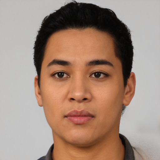 Neutral latino young-adult male with short  black hair and brown eyes