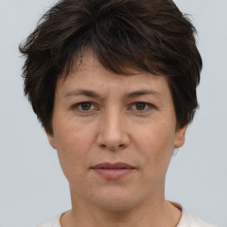 Joyful white adult female with short  brown hair and brown eyes