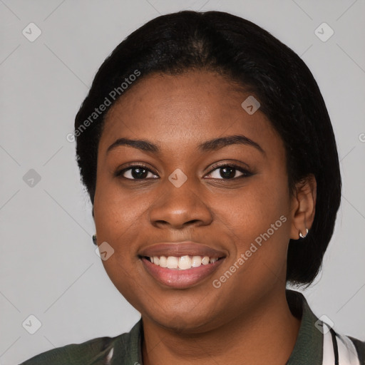 Joyful black young-adult female with medium  black hair and brown eyes