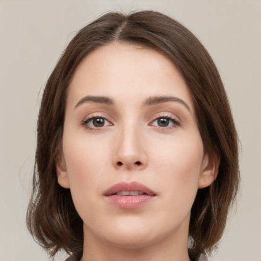 Neutral white young-adult female with medium  brown hair and brown eyes