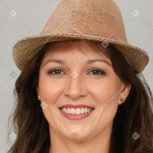 Joyful white adult female with long  brown hair and brown eyes