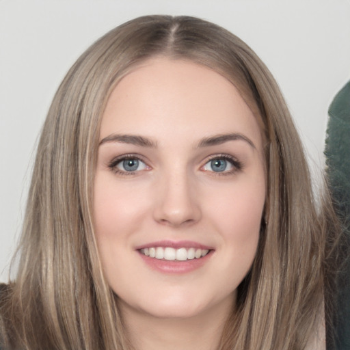 Joyful white young-adult female with long  brown hair and grey eyes