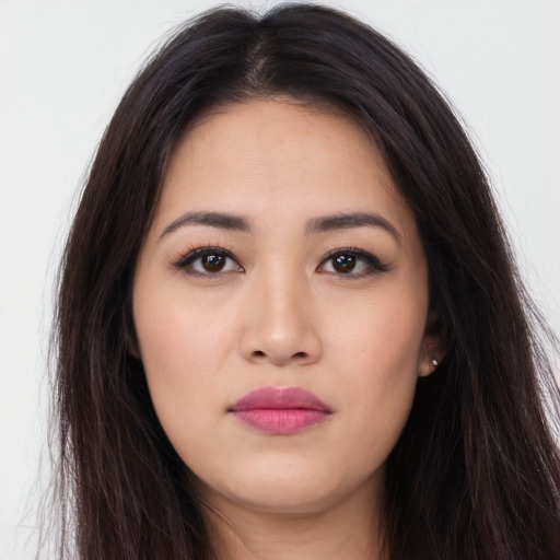Neutral latino young-adult female with long  brown hair and brown eyes