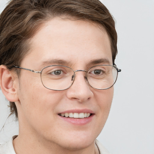 Joyful white adult female with short  brown hair and grey eyes