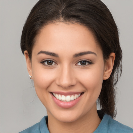 Joyful white young-adult female with medium  brown hair and brown eyes