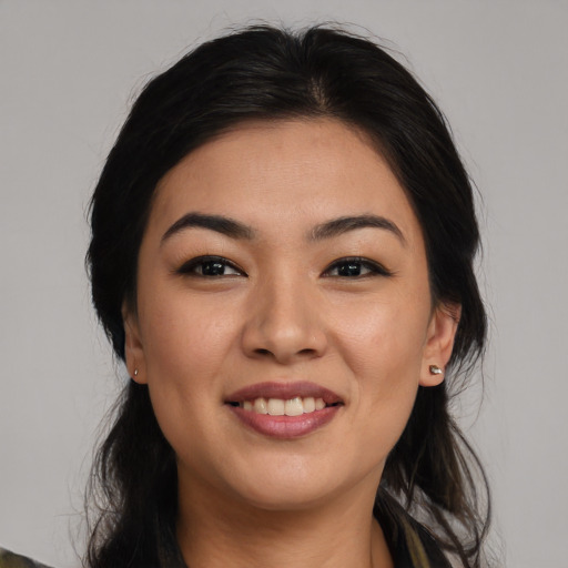 Joyful asian young-adult female with long  brown hair and brown eyes