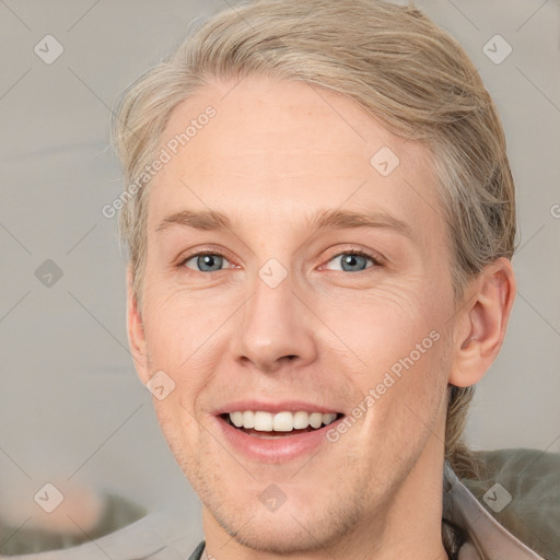 Joyful white adult male with short  brown hair and grey eyes