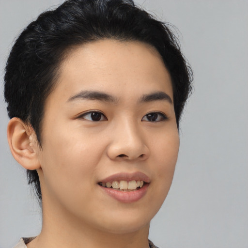 Joyful asian young-adult female with medium  black hair and brown eyes