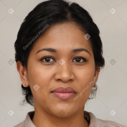 Joyful latino adult female with medium  brown hair and brown eyes