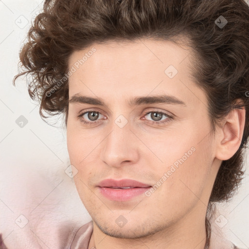 Joyful white young-adult male with medium  brown hair and brown eyes