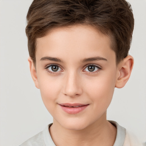 Joyful white child male with short  brown hair and brown eyes