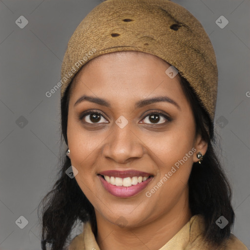 Joyful black young-adult female with long  brown hair and brown eyes