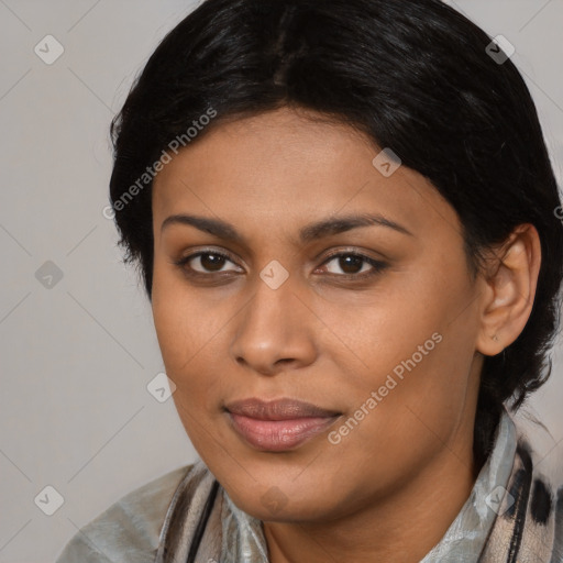 Joyful black young-adult female with medium  black hair and brown eyes