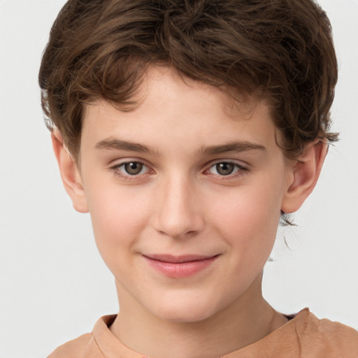 Joyful white child male with short  brown hair and brown eyes