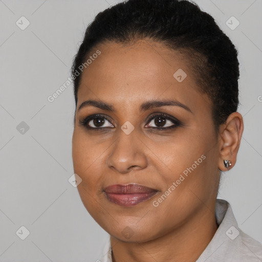 Joyful black young-adult female with short  brown hair and brown eyes