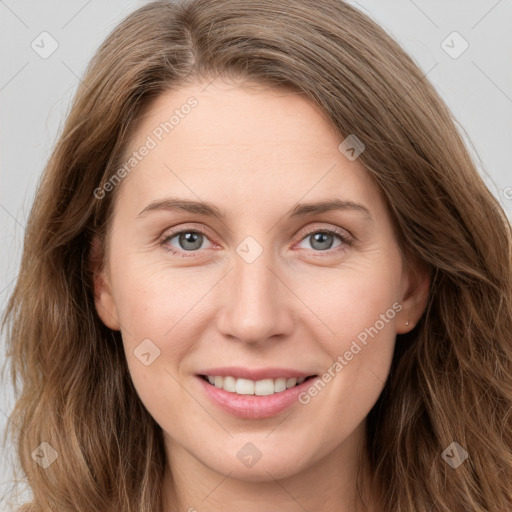 Joyful white young-adult female with long  brown hair and green eyes