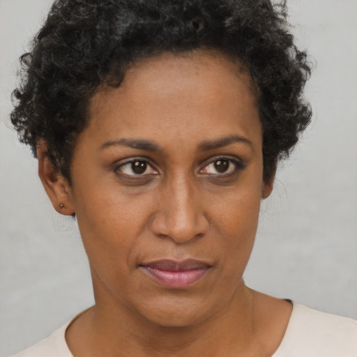 Neutral black young-adult female with short  brown hair and brown eyes