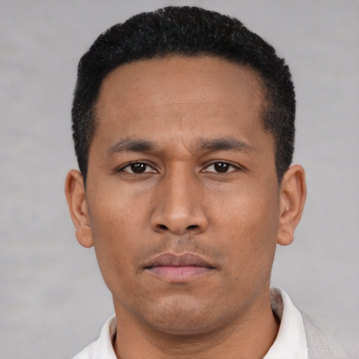 Neutral latino young-adult male with short  black hair and brown eyes