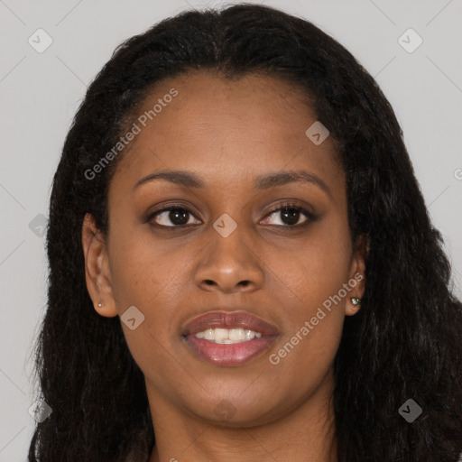 Joyful black young-adult female with long  brown hair and brown eyes