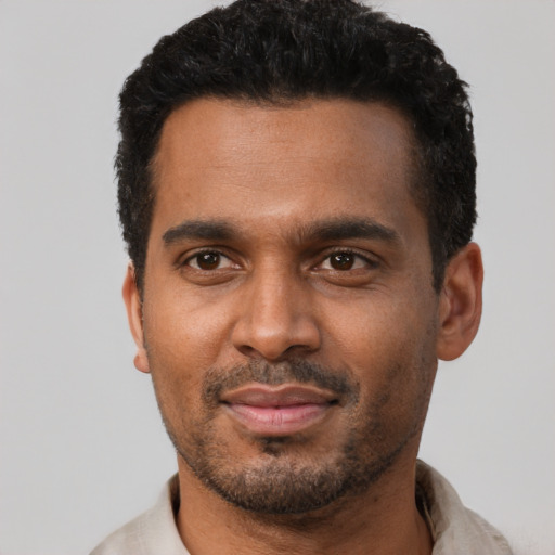 Neutral black adult male with short  black hair and brown eyes