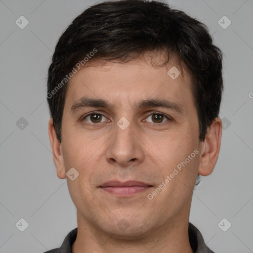 Joyful white young-adult male with short  brown hair and brown eyes