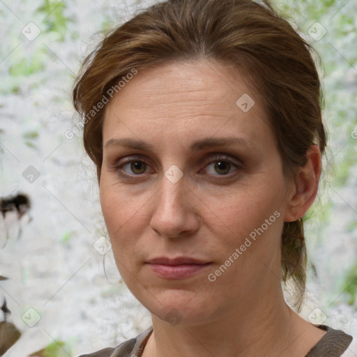 Joyful white adult female with medium  brown hair and brown eyes