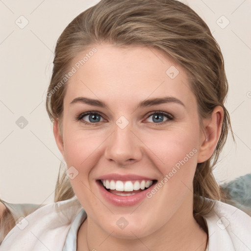 Joyful white young-adult female with medium  brown hair and blue eyes