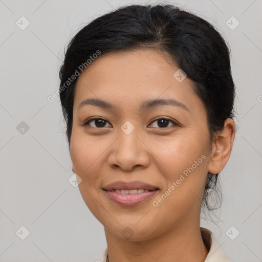 Joyful latino young-adult female with medium  black hair and brown eyes