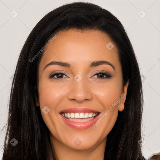 Joyful latino young-adult female with long  brown hair and brown eyes