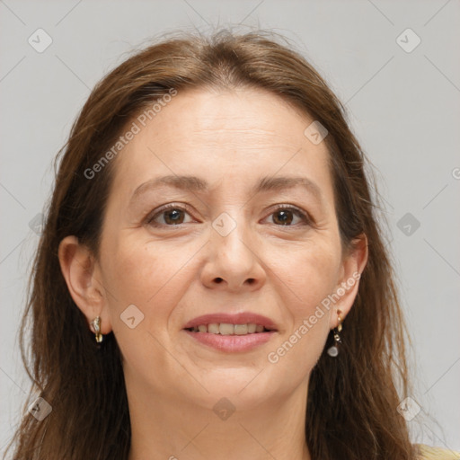 Joyful white adult female with long  brown hair and brown eyes