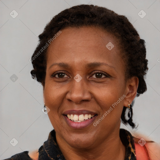 Joyful black adult female with short  brown hair and brown eyes