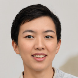 Joyful asian young-adult female with short  black hair and brown eyes