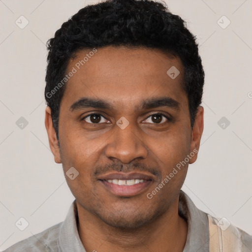 Joyful black young-adult male with short  black hair and brown eyes