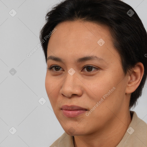 Joyful asian young-adult female with short  brown hair and brown eyes