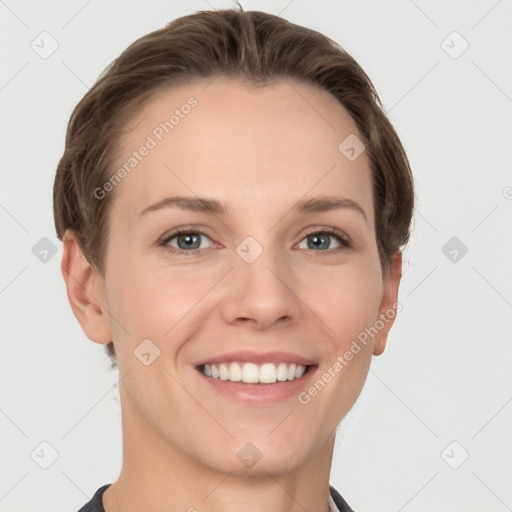 Joyful white young-adult female with short  brown hair and grey eyes