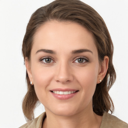 Joyful white young-adult female with medium  brown hair and grey eyes