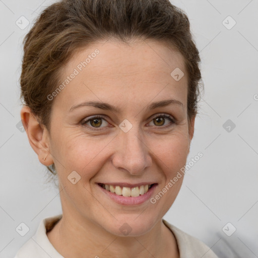 Joyful white adult female with short  brown hair and brown eyes