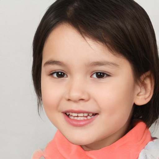 Joyful white child female with medium  brown hair and brown eyes