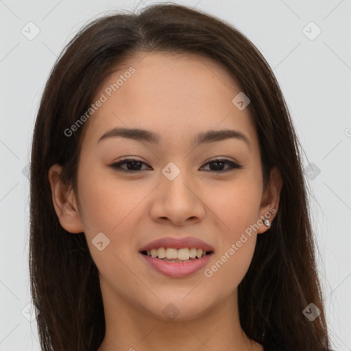 Joyful asian young-adult female with long  brown hair and brown eyes